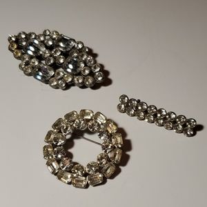 Silver tone brooches